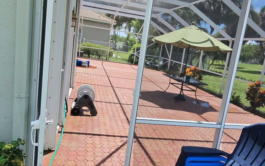 Paver deck flooring after cleaning inside a screened enclosure