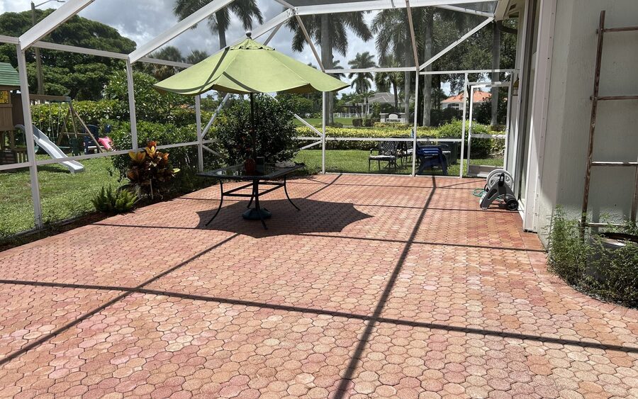 Wide view of a screened lanai after cleaning with the aluminium frame and screen panels clear