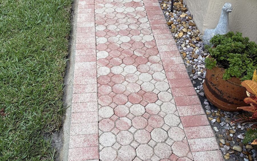 Paver walkway after cleaning running the length of the house to the entry