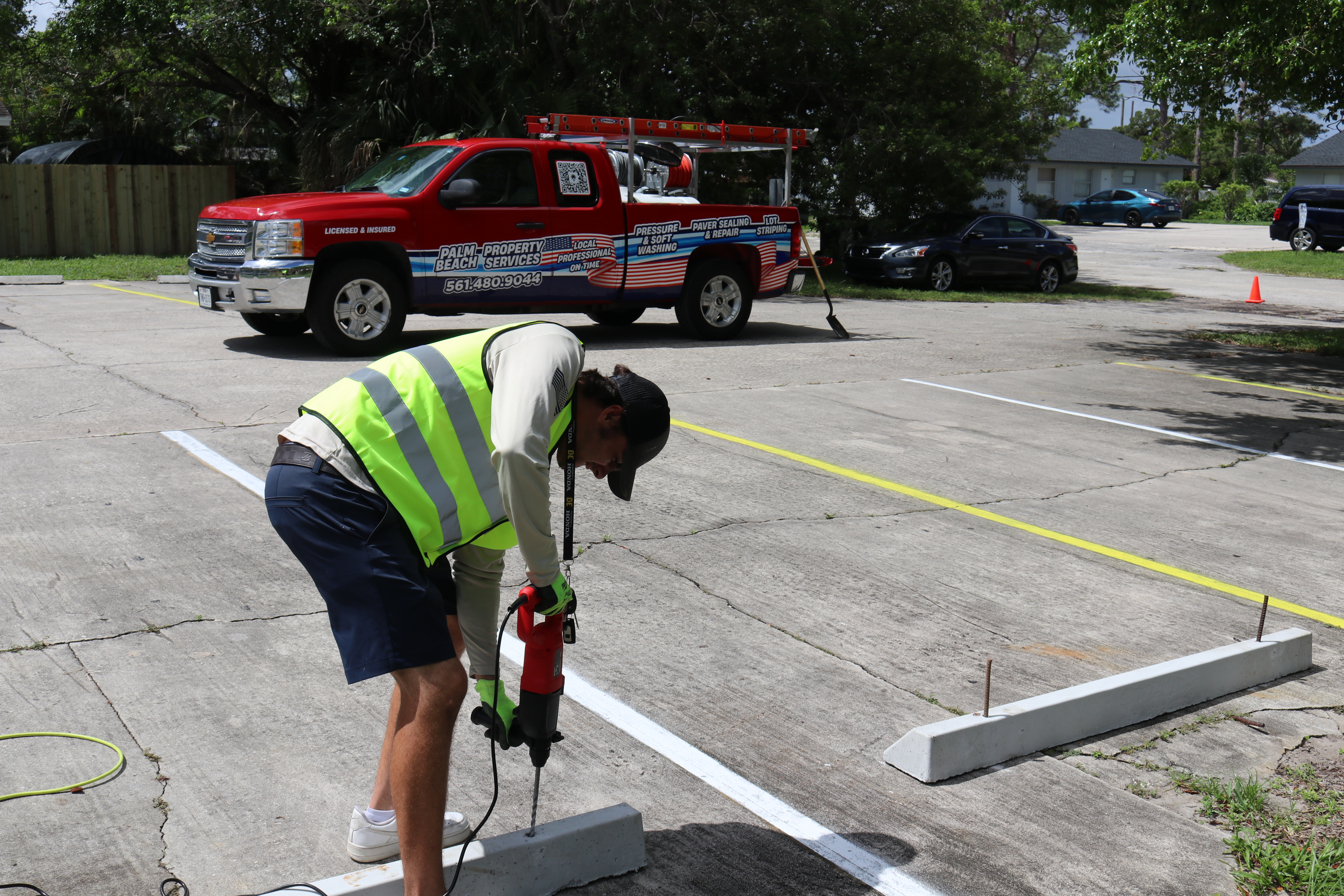 Wheel stop installation in commercial parking lot