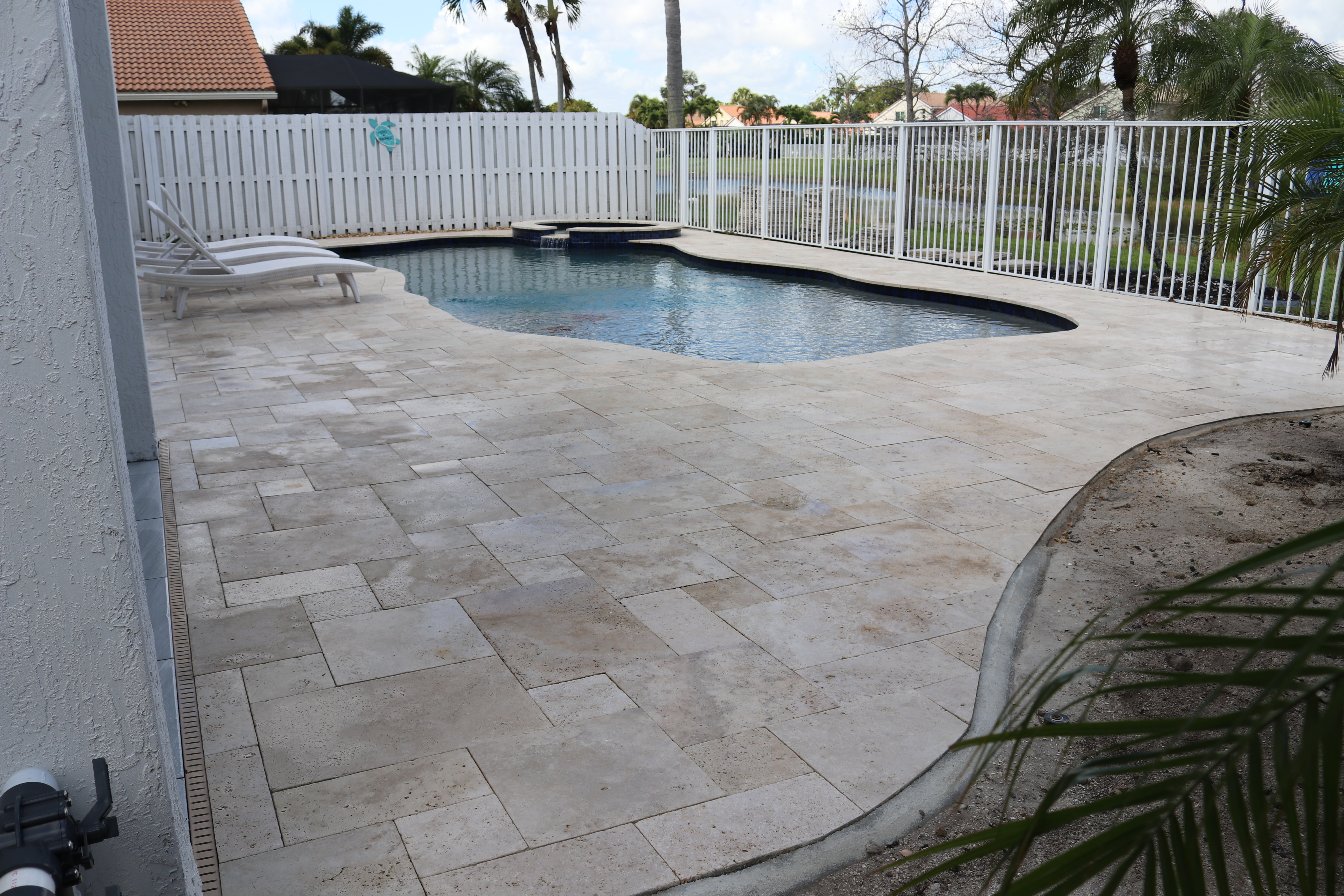 Travertine pool deck after professional paver sealing